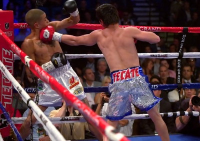 Image: Arce takes Vazquez Jr. into the deep rounds and stops him