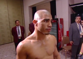 Image: Cotto thinks he's going to cut off the ring on Foreman - Good luck