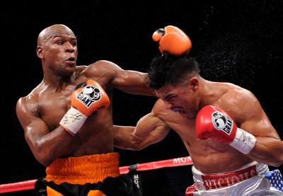Image: Mayweather gets away with a cheap shot in stopping Ortiz