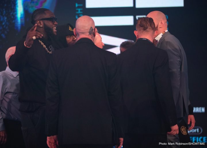 Image: Deontay Wilder shoves Tyson Fury at London press conference