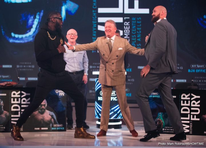 Image: Deontay Wilder shoves Tyson Fury at London press conference