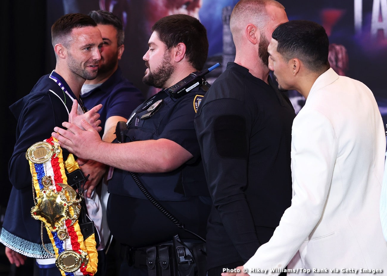 Image: Josh Taylor & Teofimo Lopez kept apart by security during face-off